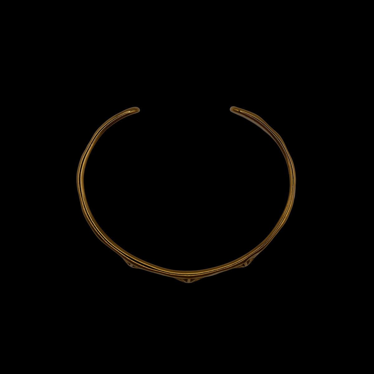 Side view of gold plated bracelet with three stars designs