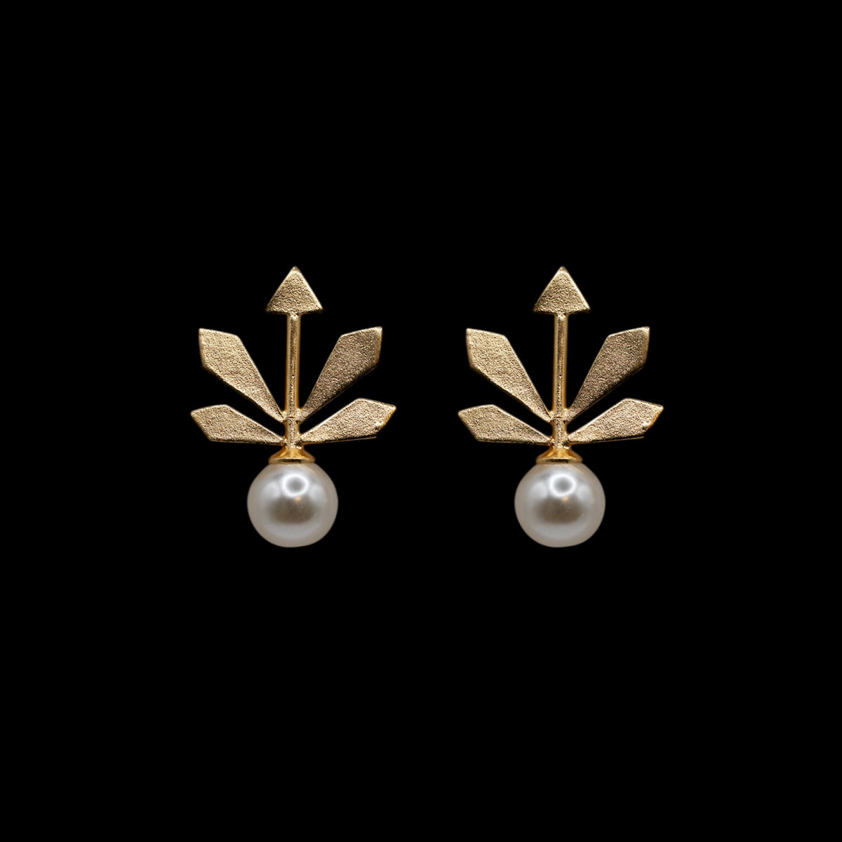 A geometric leaf-shaped earring with a pearl named the five elements on a black background