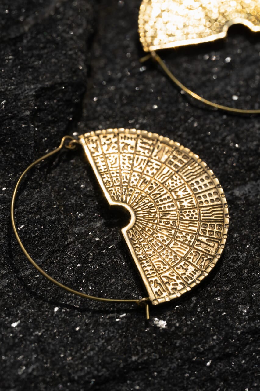 Brass golden hoop earrings with intricate design