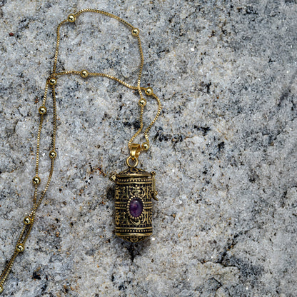 Engraved Tibetan mediation pendant with storage and amethyst gemstone