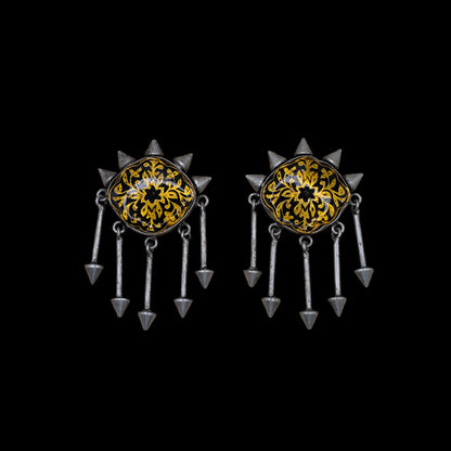 A pair of ornate indian earring with hand-painted meenakari enamel pattern