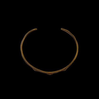 Side view of gold plated bracelet with three stars designs