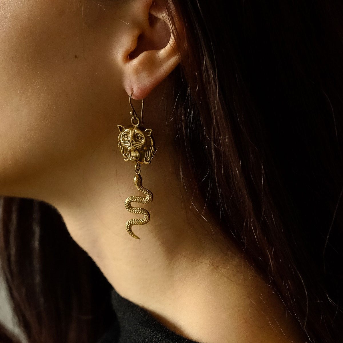 Golden antique lion and snake earrings