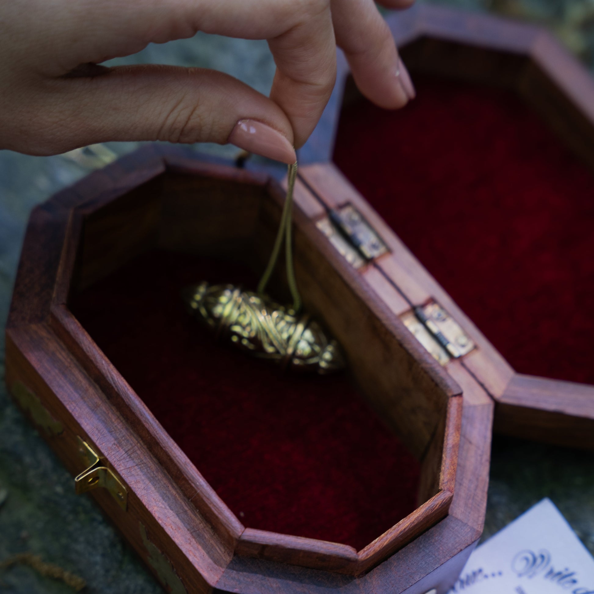Interior view of a wooden jewellery kashmiri gift box with intricate hand carvings and brass detailing