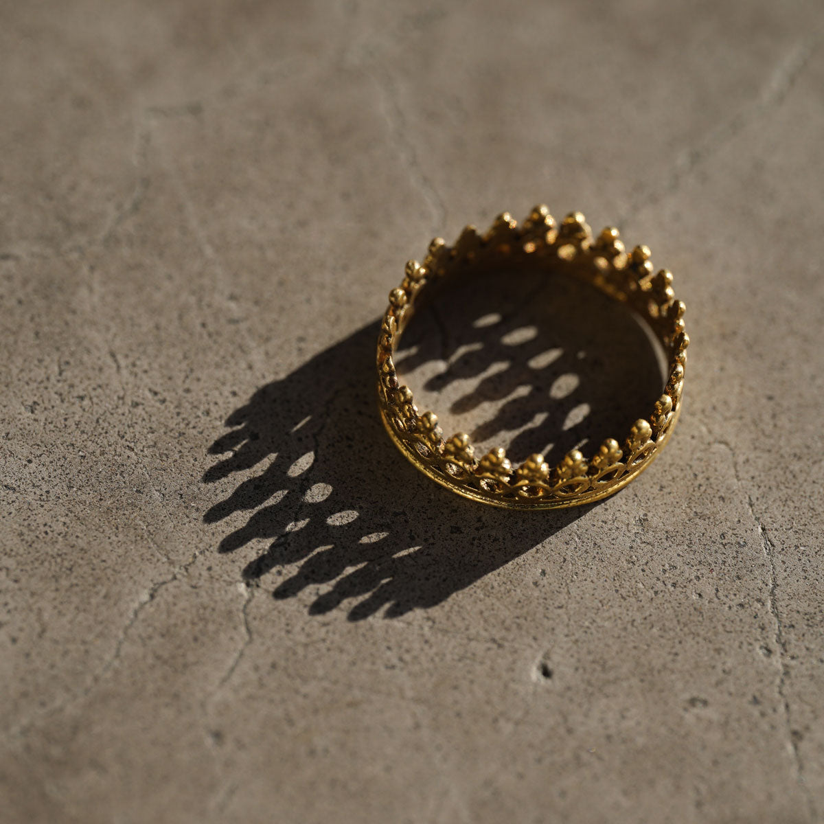 Antique brass golden ring close up in light