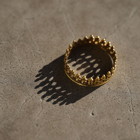 Antique brass golden ring close up in light