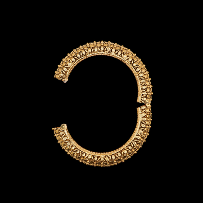 Side view of ornate intricate Indian bangle hinge opening