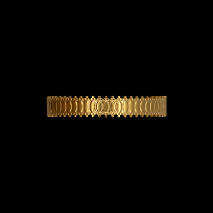 Matte gold plated bracelet with intricate border on a black background