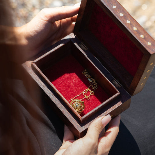 Decorative wooden gift, jewelry, hand-carved, box with golden brass etchings and red velvet inside