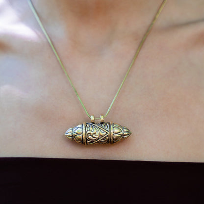 Antique golden brass necklace with an ornate pendant