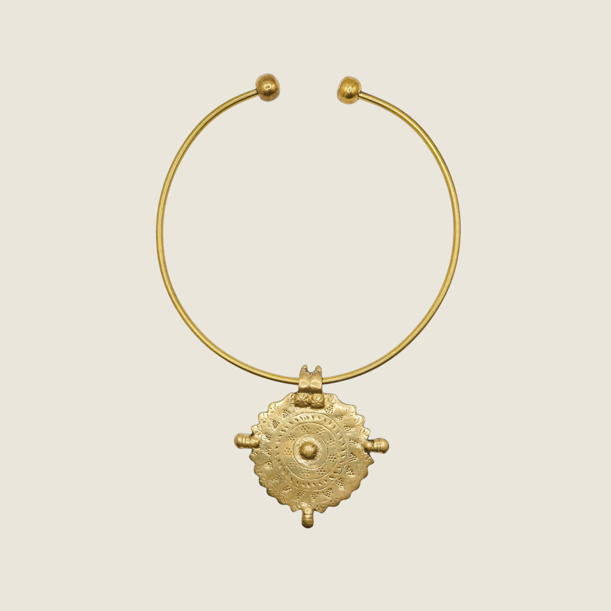 Bohemian brass necklace hasli style with a medallion sun pendant