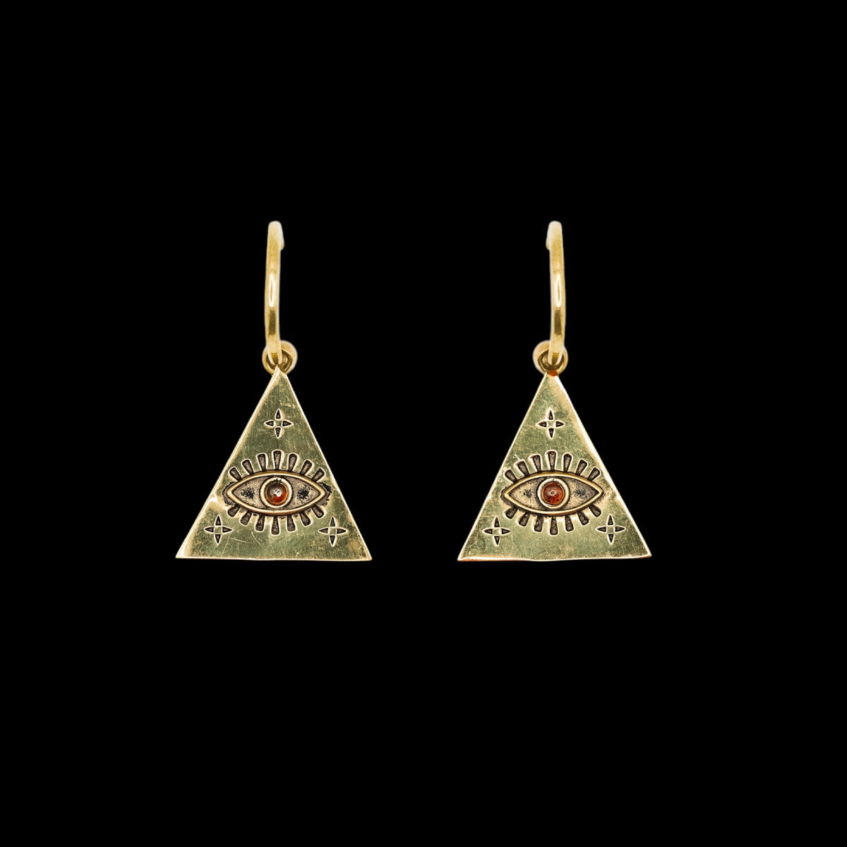 Pair of a triangle-shaped earring with an eye design and maroon stone