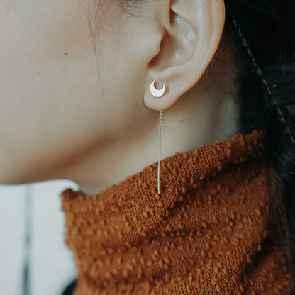 Woman wearing a threader earring in 925 silver crescent shaped